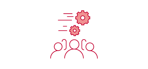 Two people sitting at a table, with a checkmark above them.