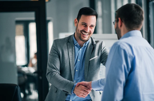 People shaking hands doing business